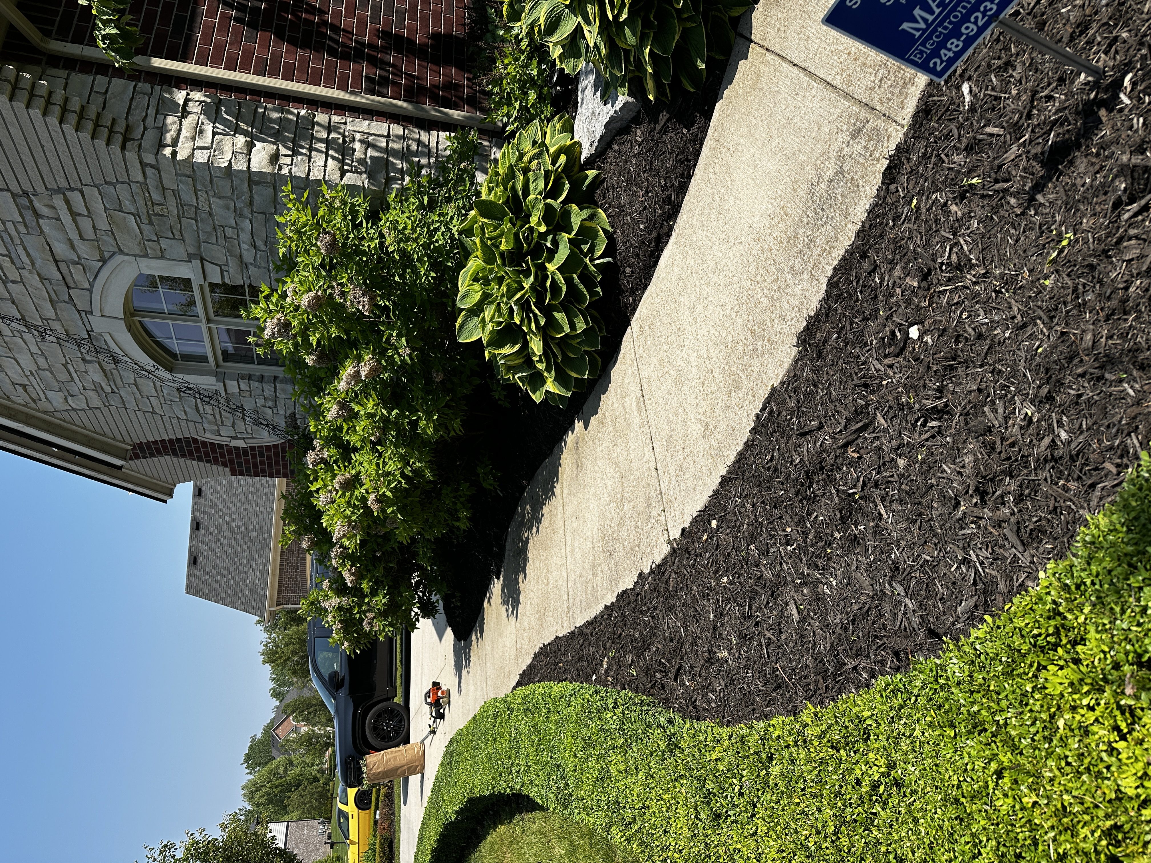 Fresh mulch installation in flower beds